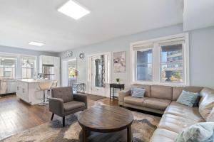 a living room with a couch and a table at 4BR 2BA Luxe Beach Estate II in Atlantic City