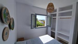 Ένα ή περισσότερα κρεβάτια σε δωμάτιο στο Apartment Filotimo