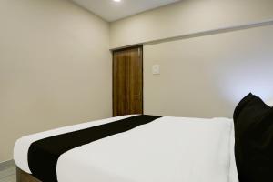 Postel nebo postele na pokoji v ubytování Super Hotel O Luxe Villa