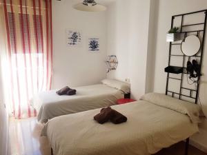 Posteľ alebo postele v izbe v ubytovaní Gran Vía flat