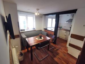 a small living room with a table and a couch at Altstadtwohnung in Lüneburg