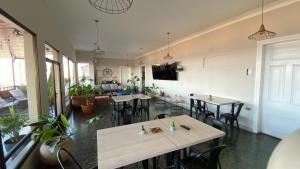 a restaurant with tables and chairs in a room at Hotel La Casona del Desierto in Huasco