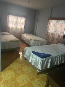 Voodi või voodid majutusasutuse Managua Hotel Oasis toas