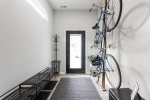 a hallway with a bike hanging on a wall at Entire Home in Fountain Square in Indianapolis