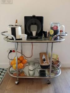 a shelf with a microwave and other items on it at beau studio centre ville in Bordeaux