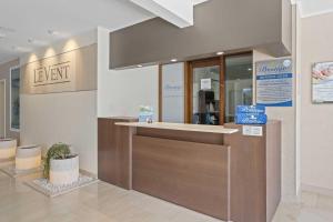 a lobby with a cash register in a store at Eagle Beach - Garden Breeze 1BR condo - LV101 in Palm-Eagle Beach +44 photos