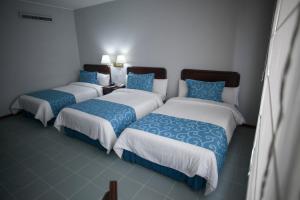 Postel nebo postele na pokoji v ubytování Hotel Internacional La Triada