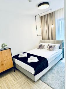 Ένα ή περισσότερα κρεβάτια σε δωμάτιο στο Apartamenty Trimont nad Jeziorem Czorsztyńskim