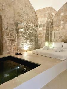 Posteľ alebo postele v izbe v ubytovaní La Cammara al Duomo Lecce Luxury Apartment