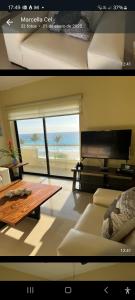 a living room with a view of the beach at Luxury Ocean Front with Activities & Entertainment in Cancún +64 photos