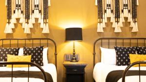 Postel nebo postele na pokoji v ubytování Hacienda El Salitre Hotel & Spa