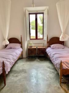 Ένα ή περισσότερα κρεβάτια σε δωμάτιο στο Casa da Mata