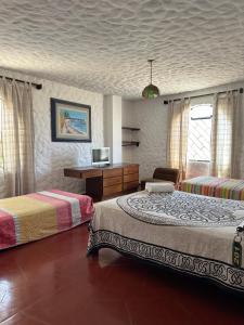 Postel nebo postele na pokoji v ubytování Ancla Hostal