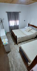 Ένα ή περισσότερα κρεβάτια σε δωμάτιο στο La Paloma Alojamiento +4 φωτογραφίες