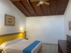 Postel nebo postele na pokoji v ubytování Hotel Pez Vela