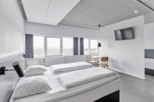 A bed or beds in a room at Four Points Flex by Sheraton Aarhus Viby