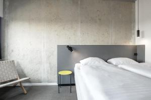 A bed or beds in a room at Four Points Flex by Sheraton Aarhus Viby