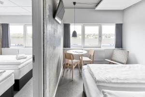 A bed or beds in a room at Four Points Flex by Sheraton Aarhus Viby