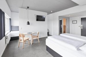 A bed or beds in a room at Four Points Flex by Sheraton Aarhus Viby