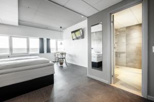 A bed or beds in a room at Four Points Flex by Sheraton Aarhus Viby