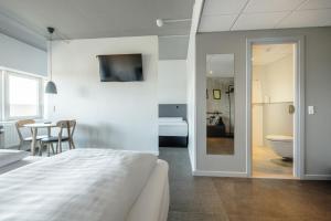 A bed or beds in a room at Four Points Flex by Sheraton Aarhus Viby