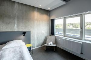 A bed or beds in a room at Four Points Flex by Sheraton Aarhus Viby