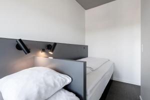 A bed or beds in a room at Four Points Flex by Sheraton Aarhus Viby