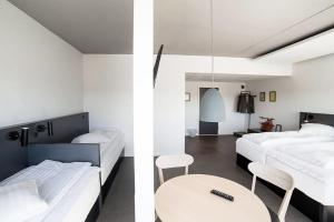 A bed or beds in a room at Four Points Flex by Sheraton Aarhus Viby