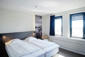 Postel nebo postele na pokoji v ubytování Four Points Flex by Sheraton Ishoj