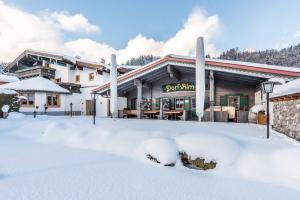 Pension Restaurant Dorfalm að vetri til
