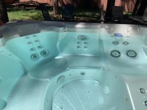 a white bath tub with at TimberWood Cabin- 3 Bdr - 2 Bth - Big Game room - Prime Location in Big Bear Lake in Big Bear Lake