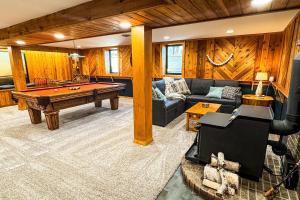 a living room with a pool table in it at TU CASA-pooltable-playset-sauna in Willmar