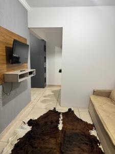 TV a/nebo společenská místnost v ubytování Casa aconchegante + 17 fotografií