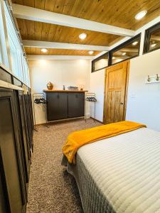 a bedroom with a bed and a desk in a room at MY PLACE! Luxury 2 Bed with piano! in Willmar