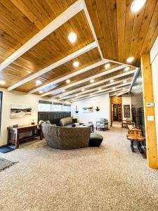 a living room with a couch and a table at MY PLACE! Luxury 2 Bed with piano! in Willmar