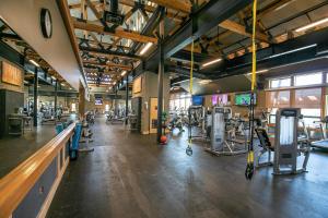 a gym with several treadmills and machines in it at Donner Gem by Tahoe Getaways - Beautifully Updated, Hot Tub, Pet Friendly in Truckee