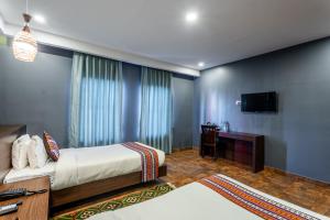 Televizorius ir (arba) pramogų centras apgyvendinimo įstaigoje Hotel Yukhang