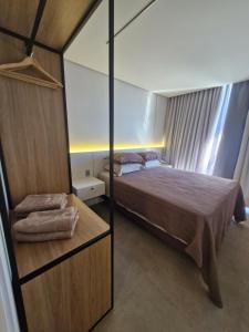 Postel nebo postele na pokoji v ubytování AP 511 - LIVIN Resort Atlântida