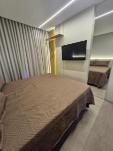 Postel nebo postele na pokoji v ubytování AP 511 - LIVIN Resort Atlântida
