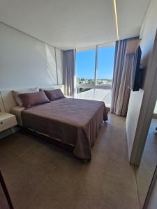 Postel nebo postele na pokoji v ubytování AP 511 - LIVIN Resort Atlântida