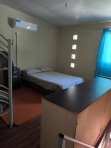 Ένα ή περισσότερα κρεβάτια σε δωμάτιο στο El Maná