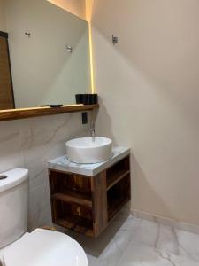 a bathroom with a sink and a toilet at Bacaanda #2 in Oaxaca City +12 photos