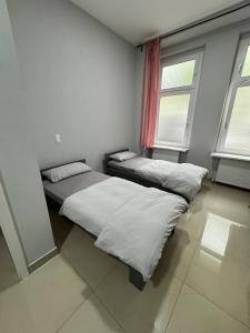 Ένα ή περισσότερα κρεβάτια σε δωμάτιο στο Berlin City 102