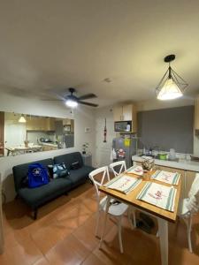 a living room with a couch and a table at San Remo Oasis 2BR Gusbek Condo Unit Rental in Basak