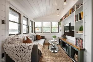 a living room with a couch and a table at Cozy & Scenic Lakeside Retreat in Leesburg