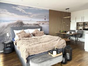 a bedroom with a bed with a beach mural at Germania-54 in Böhl