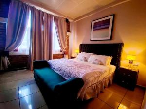 Postel nebo postele na pokoji v ubytování Hotel El Campanario