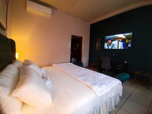 Postel nebo postele na pokoji v ubytování Hotel El Campanario
