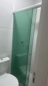 a glass shower in a bathroom with a toilet at Residencial SC in Manaus