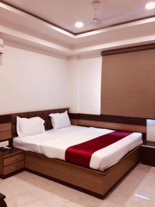 Postel nebo postele na pokoji v ubytování Hotel Gharana Tree